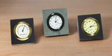 Black slate Mini Sebago thermometer with white face, Green slate Mini Sebago clock with white face, and Black slate Mini Sebago clock with a gold face