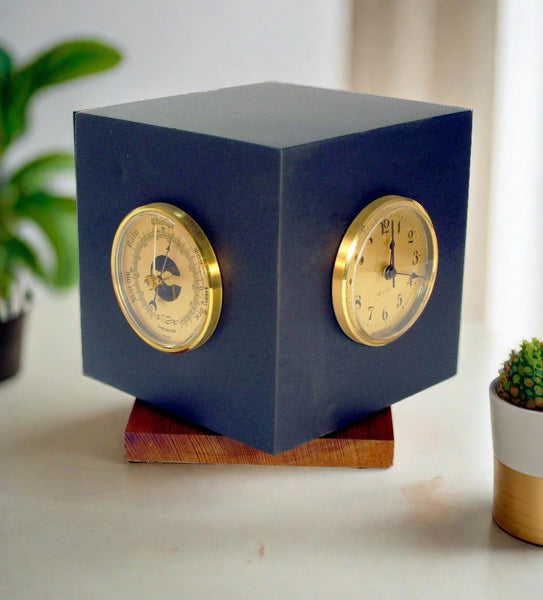 Black slate Kezar spinning weather cube with barometer and clock inserts showing