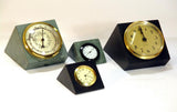 Two green slate and two black slate Little Sebago and Mini Sebago clocks and thermometer with gold and white faces