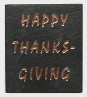 Textured black slate magnet with inscribed text: Happy Thanksgiving
